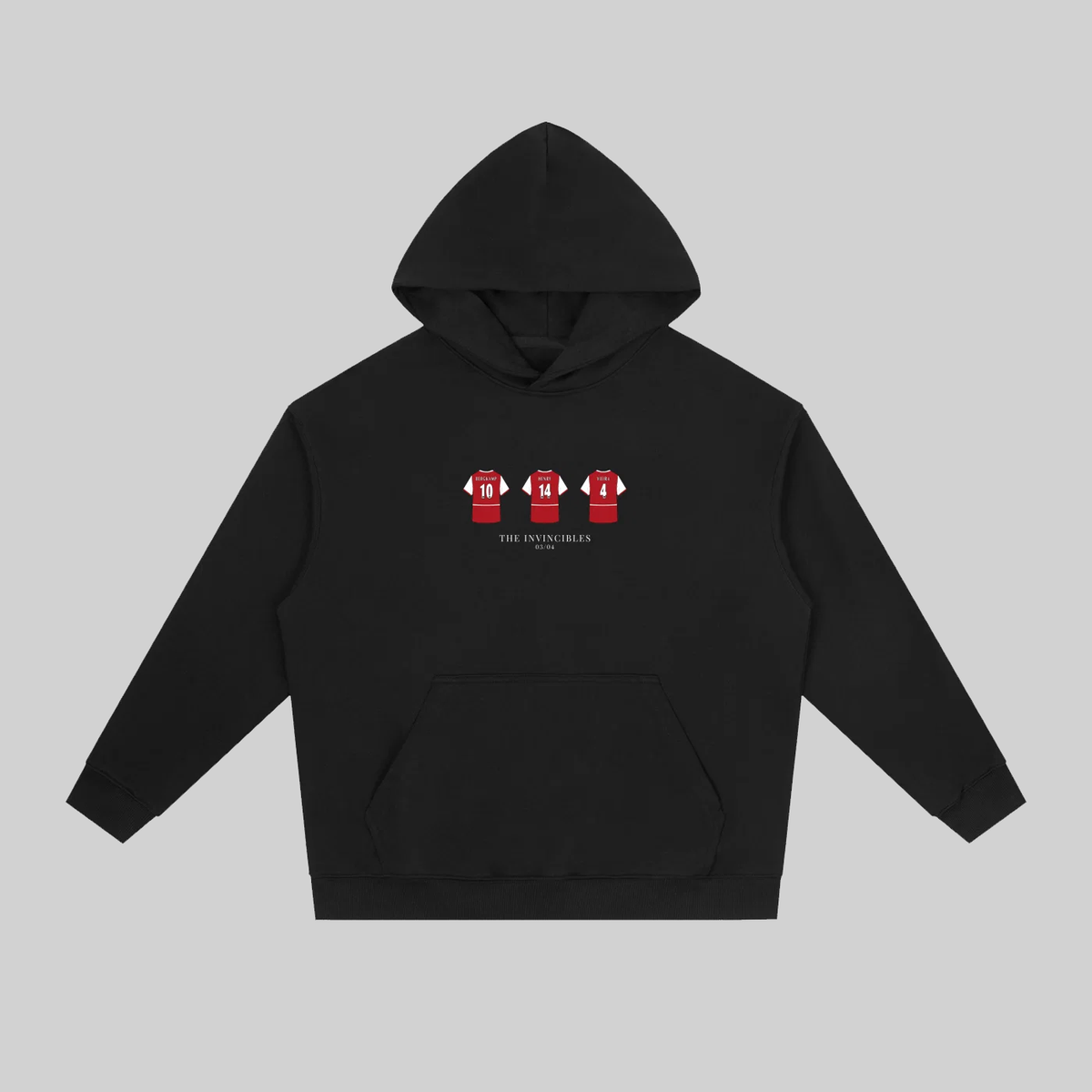 A black pullover hoodie with a front kangaroo pocket and a small chest graphic showing three red soccer jerseys with white numbers. The hoodie is displayed flat against a solid gray background.