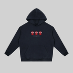 A dark navy blue pullover hoodie with a front kangaroo pocket and a small chest graphic showing three red and white football jerseys. The hoodie is displayed flat against a solid light gray background.