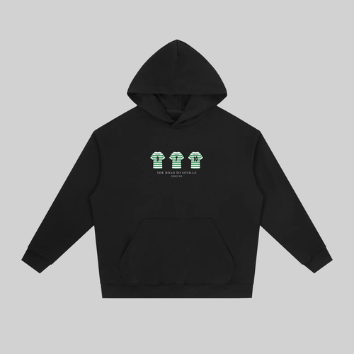 Relive Celtic’s unforgettable 2002/03 UEFA Cup run with this Road to Seville Hoodie, a tribute to the legendary team that captured hearts across Europe