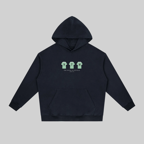 Relive Celtic’s unforgettable 2002/03 UEFA Cup run with this Road to Seville Hoodie, a tribute to the legendary team that captured hearts across Europe
