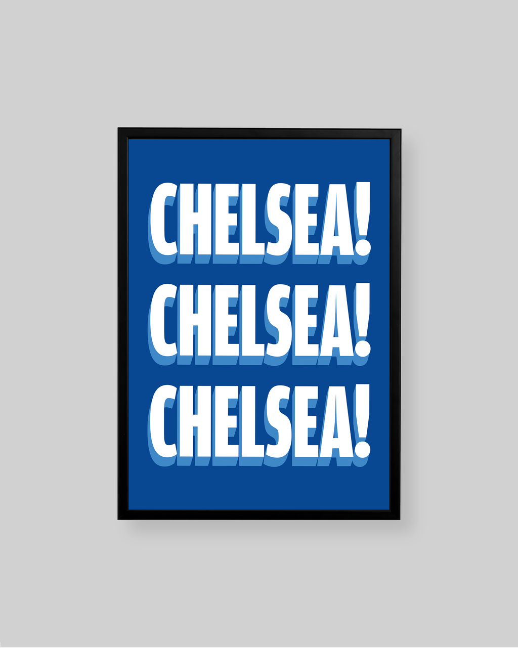 A framed typographic wall art print featuring the word 'CHELSEA!' repeated three times in bold white letters with a blue-and-white shadow effect on a blue background, shown against a light gray wall.