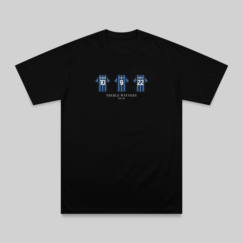 A black short-sleeve crewneck t-shirt with a graphic on the chest showing three blue and white striped hockey players wearing numbers 16, 18, and 22, with the text 'THREE WINNERS' and 'Vancouver' below it, displayed on a neutral gray background.