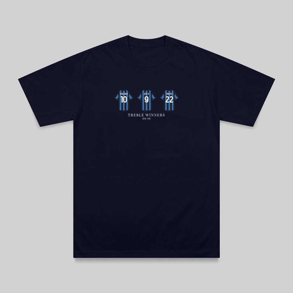 A navy blue short-sleeve t-shirt with a graphic on the chest showing three stylized blue and white figures with numbers 16, 8, and 2, and the text 'THREE WINNERS' underneath, displayed on a neutral gray background.