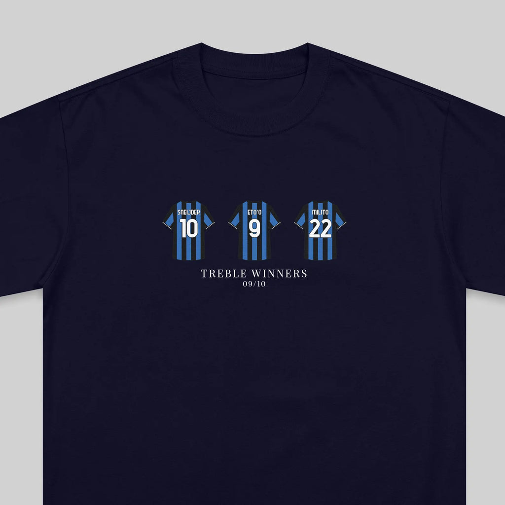 A navy blue crewneck t-shirt featuring a graphic of three blue and black striped soccer jerseys with the numbers 10, 9, and 22, above the text 'TREBLE WINNERS' and '09/10'.