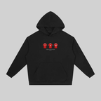 A black pullover hoodie with a front kangaroo pocket and a small chest graphic showing three red soccer jerseys with white numbers. The hoodie is displayed flat against a solid gray background.