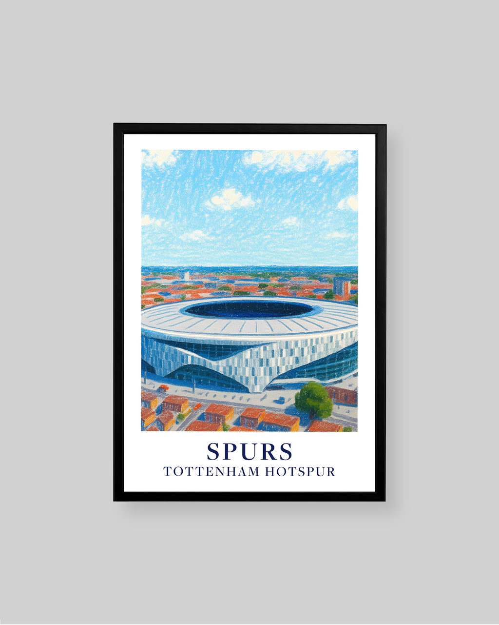 A framed sports poster of the Tottenham Hotspur stadium, featuring a blue and white illustration of the stadium under a blue sky, with the text 'SPURS' and 'TOTTENHAM HOTSPUR' at the bottom. The poster is framed in black and displayed against a neutral gray background.